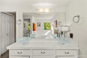 Double Vessel Sinks and Tile countertops in the Primary bath