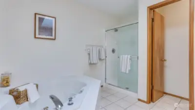 Primary bath offers tile floors, soaker tub & walk-in shower.