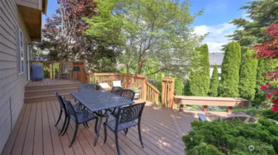 Extend your living to this entertainment sized brand new two-tiered Trex deck, great for hosting all summer long!