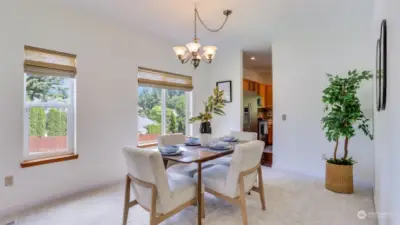 The formal dining room is spacious and light & bright with views of the extended side yard.