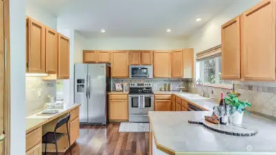 Enjoy convenient desk space in this kitchen making this truly the heart of the home.