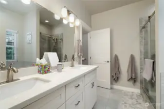 Primary bath with dual sinks and lots of counter space.