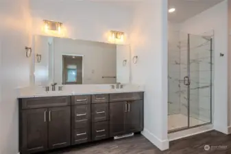 Prepare to be captivated by the dreamy Primary Bathroom! Revel in the expansive mirror, dual sink vanity boasting fabulous storage and stunning quartz counters. The touch of a dial directs warm air out from a vent below the vanity to keep your toes nice and toasty.