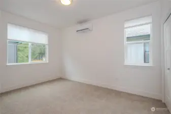 The second upstairs Bedroom is generously sized and carpeted for comfort. It boasts a dedicated ductless mini-split heating & cooling and a sizable closet.