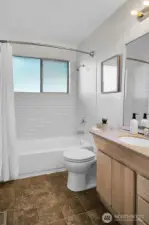 Main bathroom with a brand new tub and classic subway tile surround.
