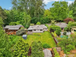 South aerial view of the backyard and exterior.