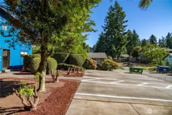 Parking spaces are extra long, each with an accessible walkway along their side.