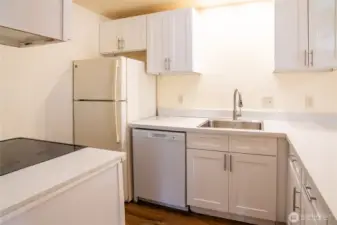 Unit 1 along with all the other 3 units feature kitchens w/ dishwasher, refrigerator and oven.