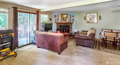 Unit 4 - Interior living room area w/ wood-burning fireplace
