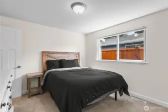 Primary Bedroom with natural light and fresh paint. Private 3/4 bathroom attached