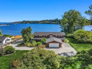.93 acre lot with tons of parking, outstanding privacy, and public utilities for additional development potential and/or a private waterfront mutil structure compound.