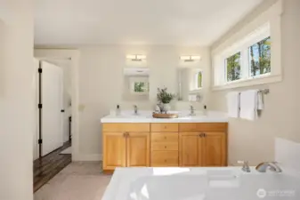 Primary bathroom with double vanity, huge soaking tub, and walk-in-shower.
