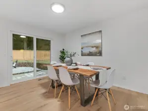 Dining area that easily fits a table for 4-8 with access to the backyard