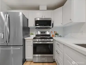 New appliance package with gas stove, steam microwave and large refrigerator