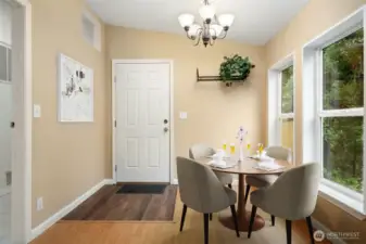 Photo contains virtual staging. Walk-in pantry and laundry are to left in this photo. Entry is updated to high durability flooring. Door is new.