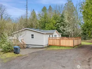 Newly fenced. Stain to color and preserve the brand new fence will come with the house for buyer to use when the weather turns dry again.