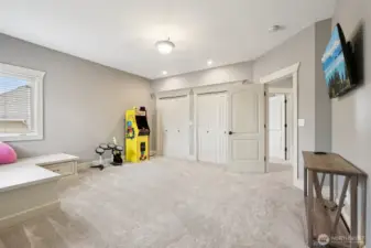 Spacious secondary bedroom or flex room offering generous square footage, plush carpeting, and ample closet storage. The versatile layout easily accommodates a variety of uses, including guest space, recreation room, or home office, with convenient access to nearby bedrooms and bath.