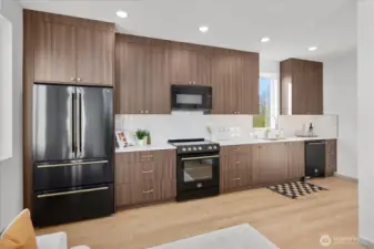 Chef’s kitchen with stainless steel appliances, quartz countertops, & abundant storage.
