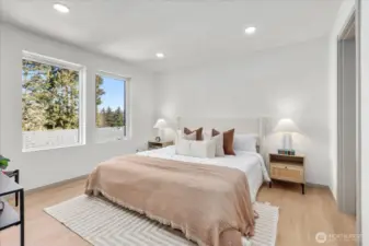 Luxurious owner’s suite with abundant natural light.