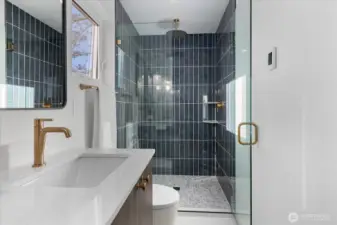 Spectacular walk-in shower with floor to ceiling tiling.