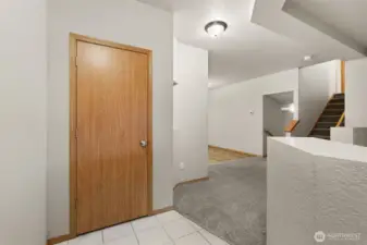 Entry opens up to living room.