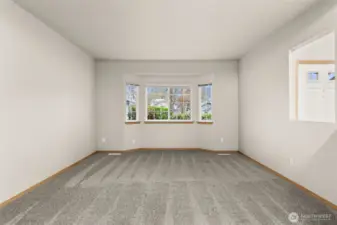 Spacious living room with a lovely bay window.