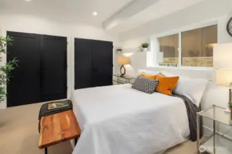 One of two generous bedrooms, note all the closet storage!