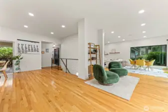 View from the kitchen looking back into the living room and downstairs access.