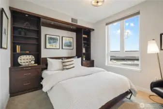 This Murphy bed, when up, has a drop-down desk, converting this west-facing view bedroom into an office