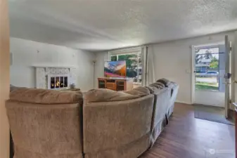 Large windows and entry door on facing west. New laminate flooring throughout living/kitchen and dining spaces.