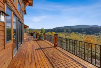 Experience the ultimate in outdoor living! Multiple decks and entertaining spaces make the most of every sunny moment, offering breathtaking views of the stunning Nisqually River Valley. Watch eagles soar majestically overhead while deer frolic right on your lush lawn—nature’s beauty is your daily backdrop!