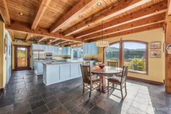 Heated slate floors lead into the dining and kitchen area.