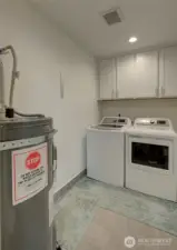 Large laundry room with storage