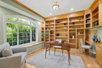 Here is the office with beautiful built-ins and hardwood floors.