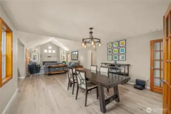 The large open concept design of this fireside living room and dining room connect to the large family room as well for an incredible main level entertainment area