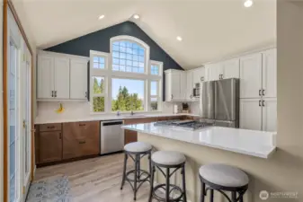 The fully renovated kitchen is complete with cooking island and breakfast bar