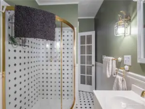 The unique shower maximizes the space in the bathroom.