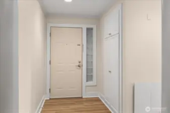 Entry into condo with storage on right.