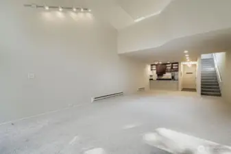 Living room expanse, stairs up to the loft Primary