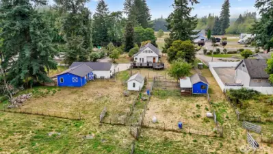 Just beyond the back yard there is a 3 car garage/shop, stable, storage shed, & chicken coop.  Perfect for your mini farm.