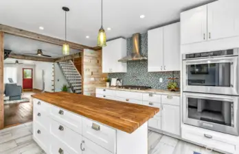 So open & inviting to prepare your meals! 5 burner gas stove, double oven, all updated for convenient cooking & entertaining!