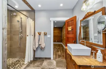 A huge shower and beautiful heated tile floors for your comfort.