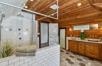 The shower in the primary bath is HUGE, very spa like, and one you could spend hours in!