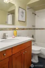 The full bath opens up the possibility of a main floor primary bedroom or a perfect guest space.
