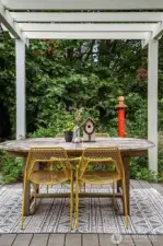 Just the right amount of lawn, a Parisian style gravel seating area and a deck made for entertaining.