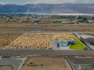 Land in back of the house goes almost to the runway - plus the 1/2 acre lot to the left = All yours!