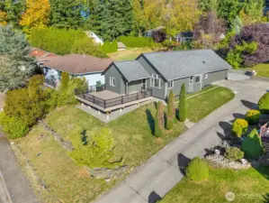 Aerial view highlighting the landscaped yard and surrounding neighborhood.