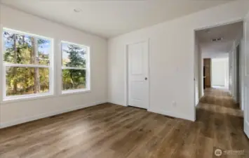 Primary Bedroom with windows facing back yard