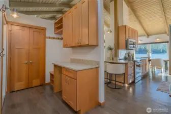 And, the butler's pantry is right off the kitchen that has another sink & laundry.  Off this room is an enclosed patio perfect for your pups.