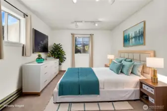 Up a few steps off the kitchen is one of the 3 good sized bedrooms. Virtually staged.